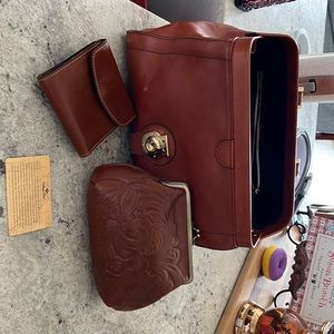 Patricia Nash purse with matching wallet and cosmetics bag.